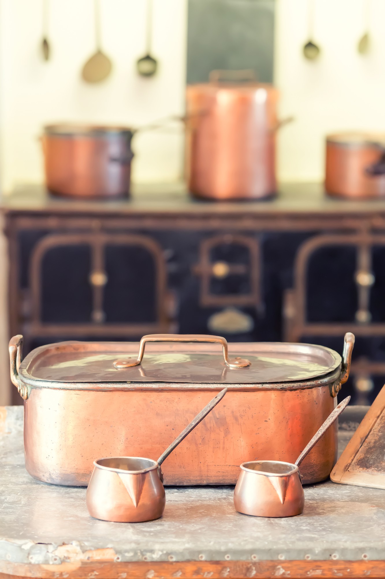 Interior of a small artisan kitchen with copper pans